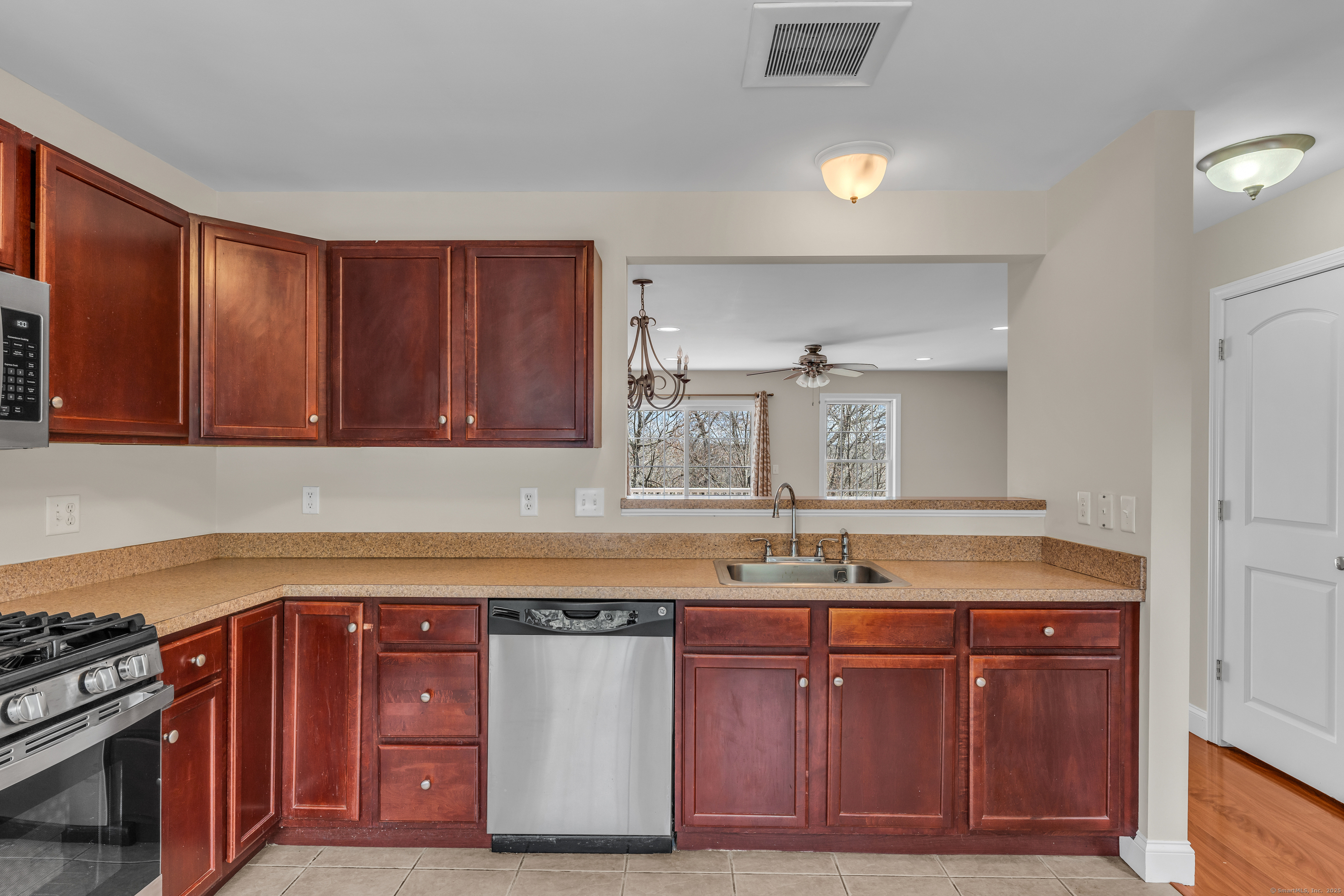 15 Freedom Way, Unit 92 Niantic, CT 06357 - Photo 6 of 33 a kitchen with a sink and cabinets