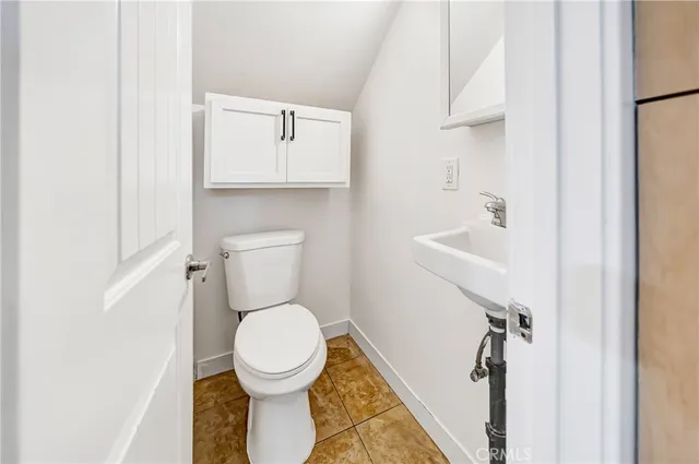 a bathroom with a toilet and a sink