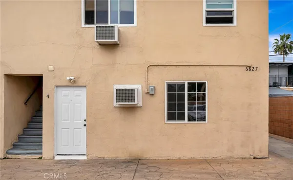a front view of a house with large windows