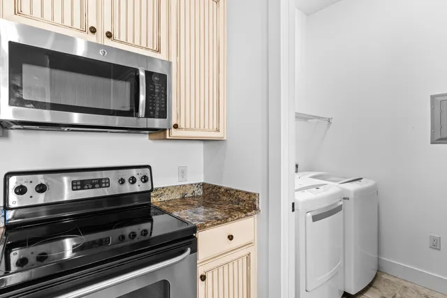 a kitchen with a stove and a microwave