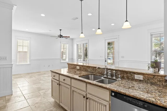 a bathroom with a granite countertop sink and a large mirror