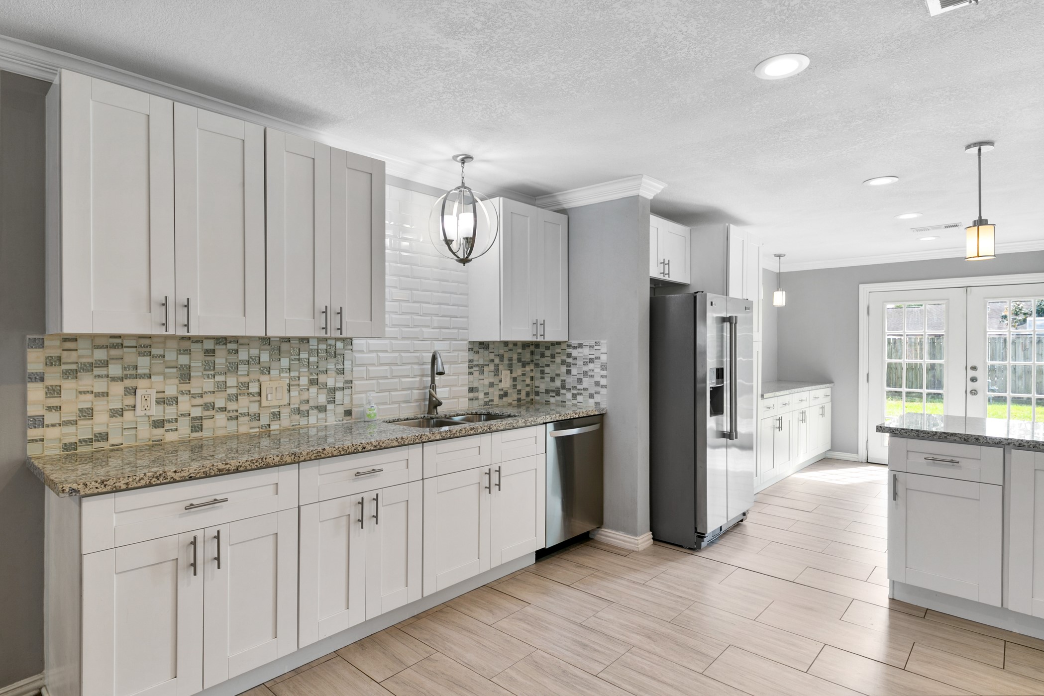 6915 Jalna Street Houston, TX 77055 - Photo 11 of 29 Tons of cabinet space and smart storage make this kitchen as functional as it is beautiful.