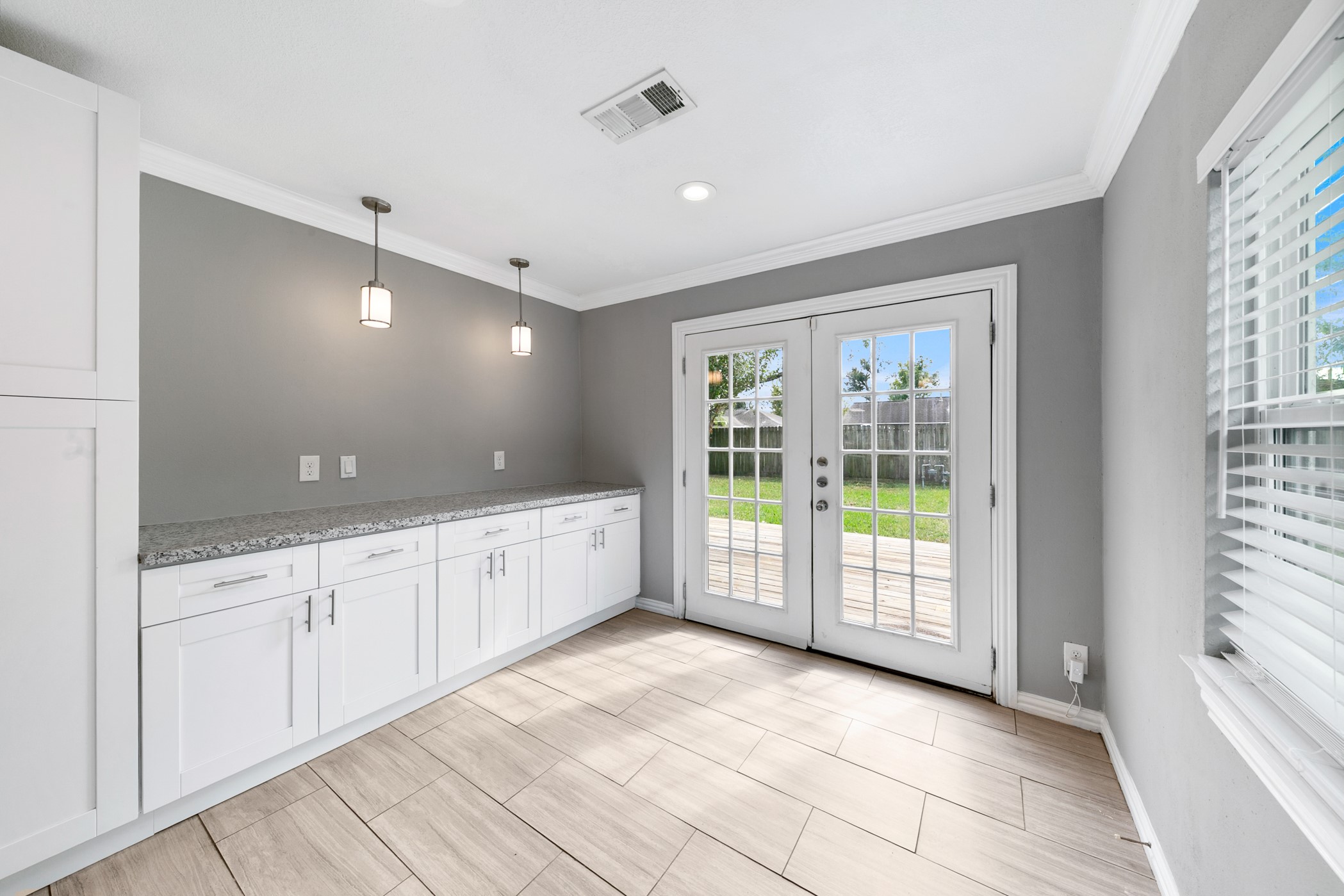 6915 Jalna Street Houston, TX 77055 - Photo 14 of 29 Beautiful French doors invite plenty of light and provide easy access to the backyard retreat.