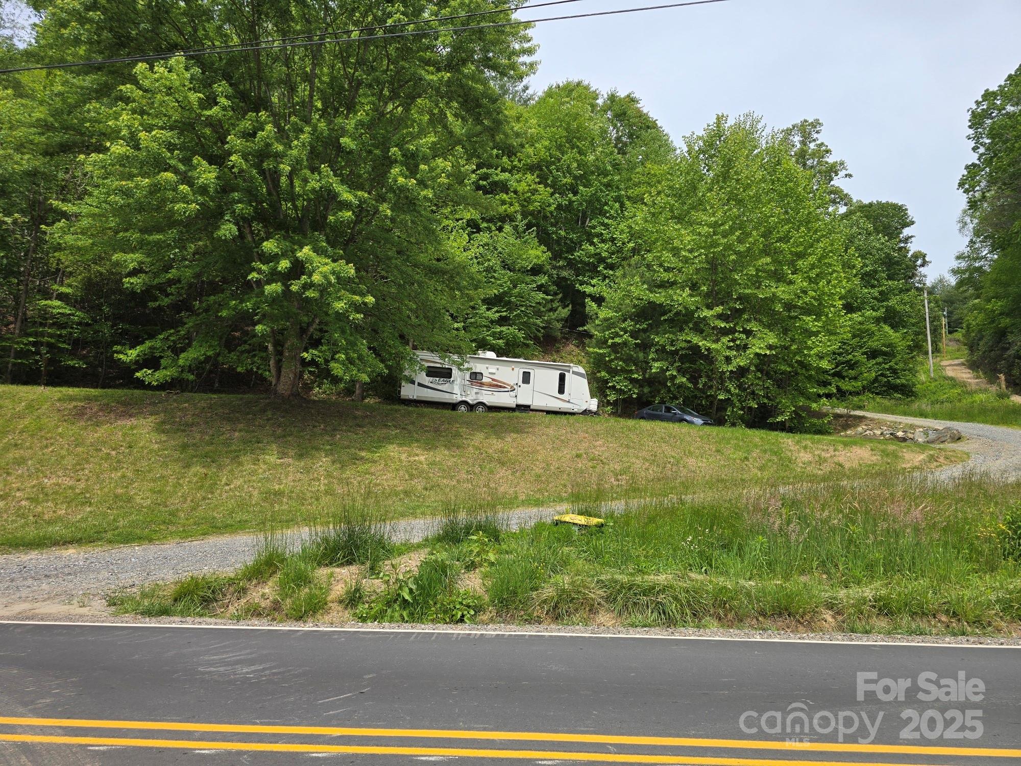 Tbd Banks Creek Road Burnsville, NC 28714 - Photo 2 of 4 a view of a lake with a yard