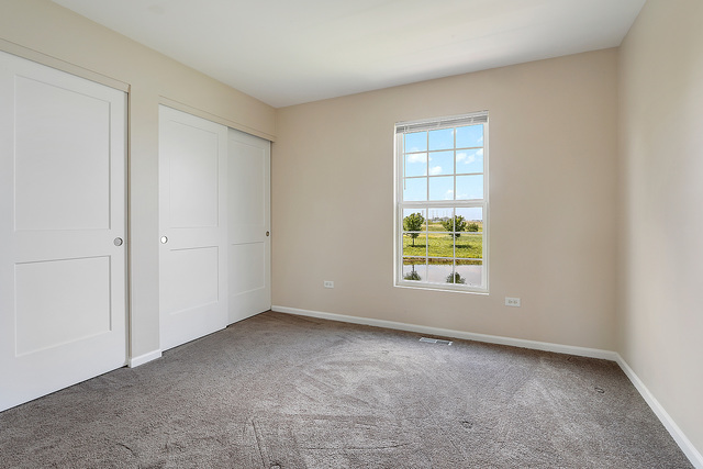 15324 Pinewood Road Lockport, IL 60441 - Photo 12 of 18 an empty room with windows
