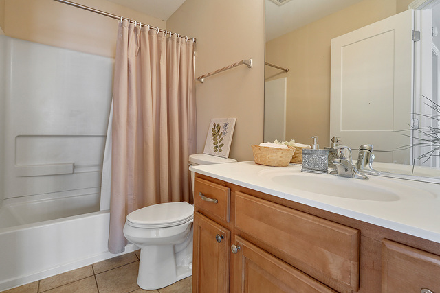 15324 Pinewood Road Lockport, IL 60441 - Photo 13 of 18 a bathroom with a sink a toilet and shower