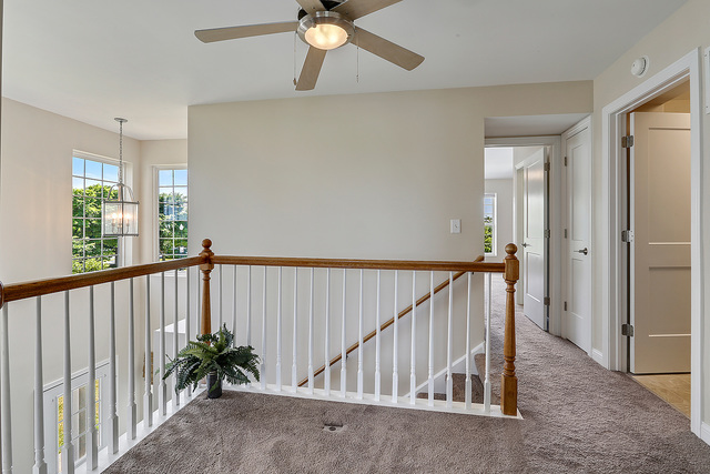 15324 Pinewood Road Lockport, IL 60441 - Photo 15 of 18 a view of staircase with railing and a chandelier