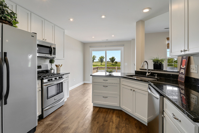 15324 Pinewood Road Lockport, IL 60441 - Photo 5 of 18 a kitchen with stainless steel appliances granite countertop a stove and a refrigerator