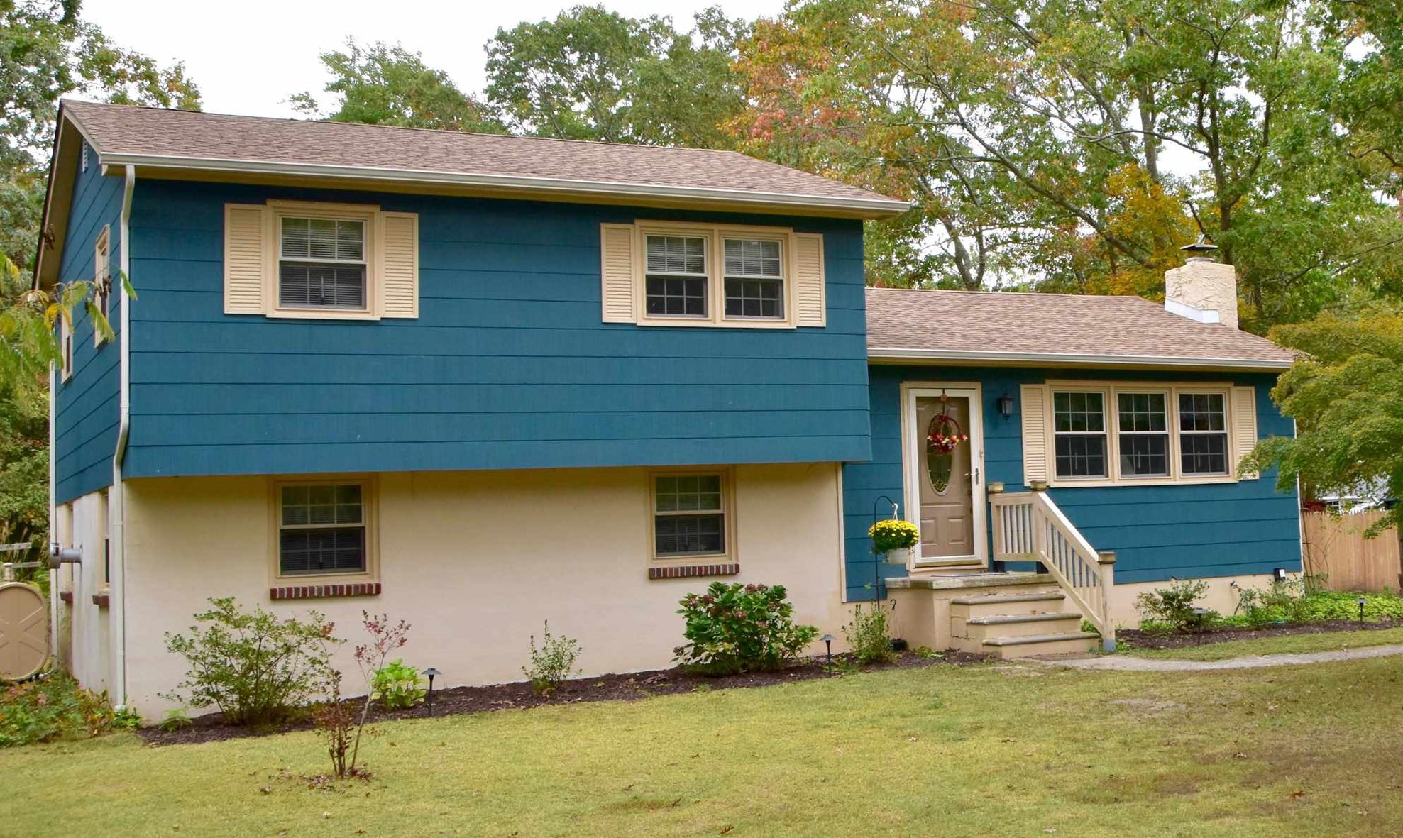 a front view of a house with a yard
