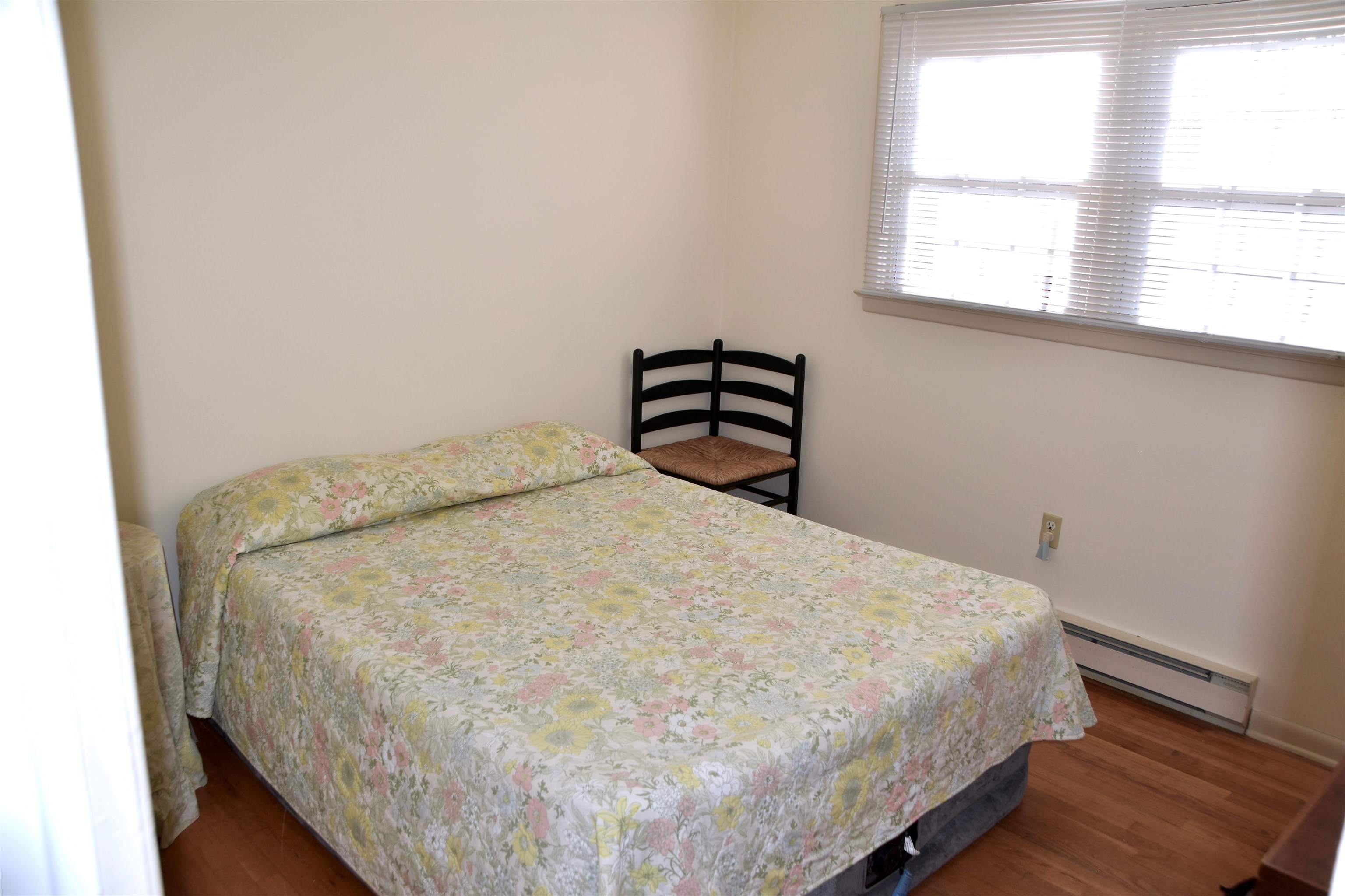 91 Tyler Road Ocean View, NJ 08230 - Photo 17 of 34 a bed sitting in a bedroom next to a window