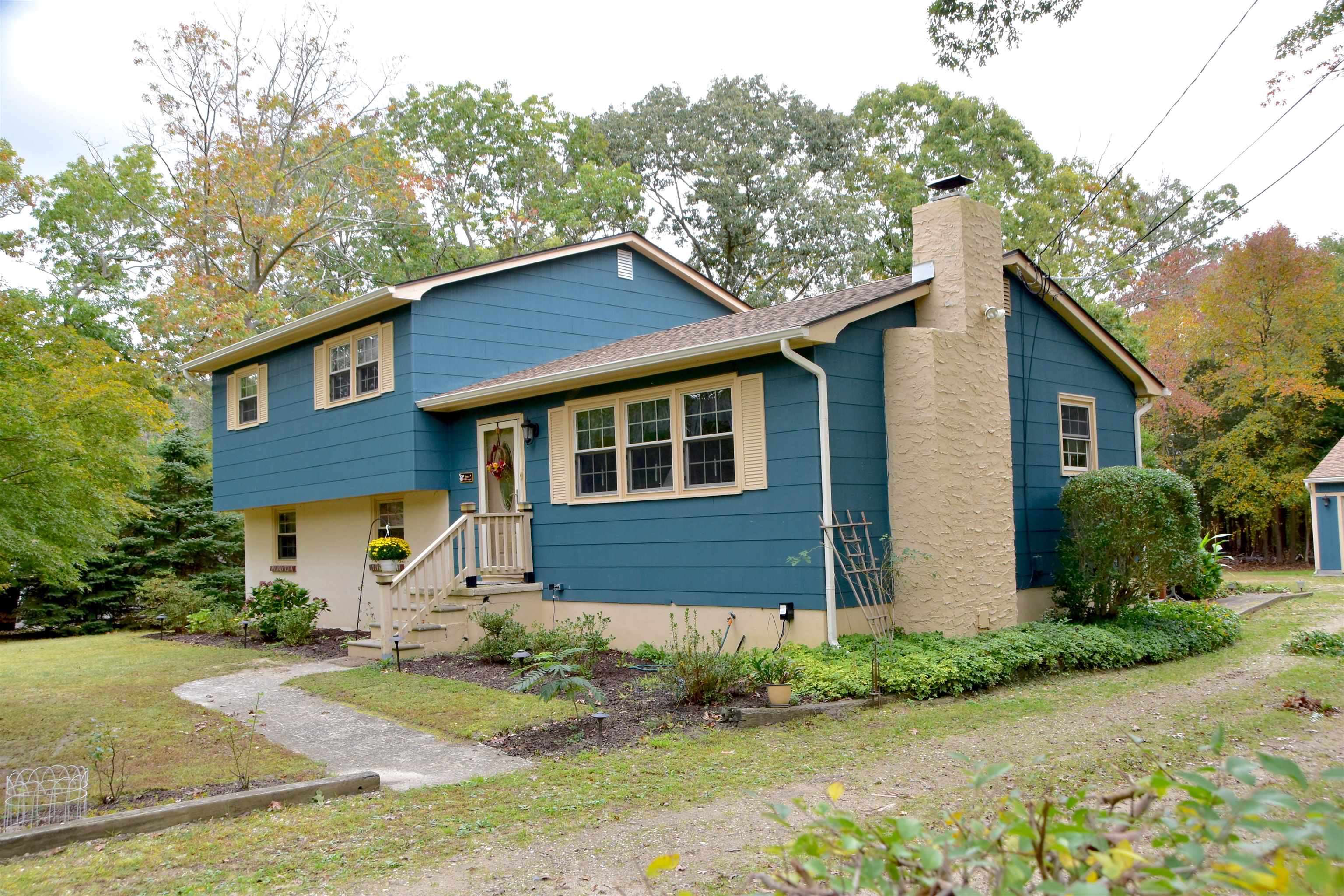 91 Tyler Road Ocean View, NJ 08230 - Photo 2 of 34 a front view of a house with garden