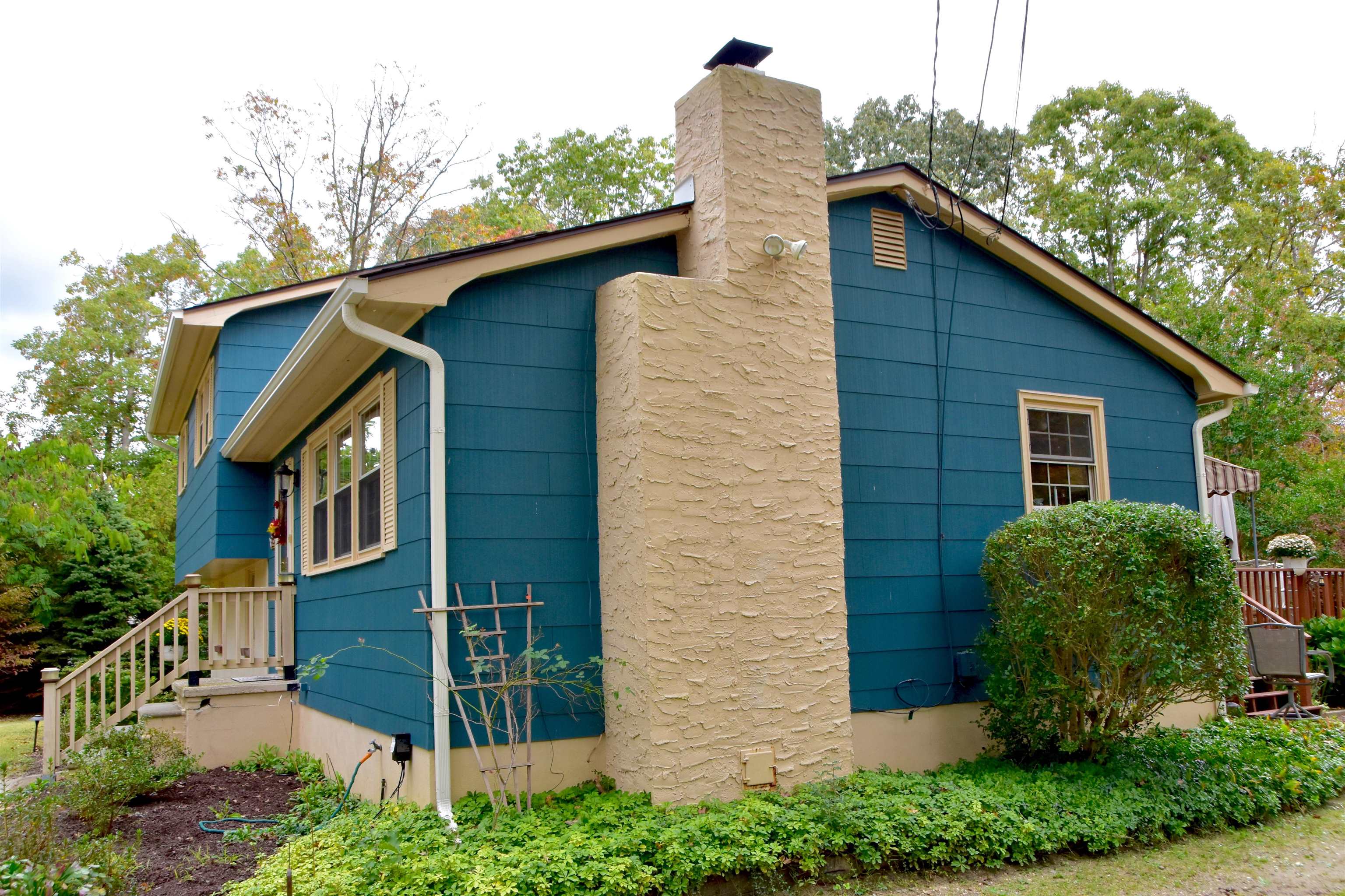 91 Tyler Road Ocean View, NJ 08230 - Photo 3 of 34 a front view of a house with a garden