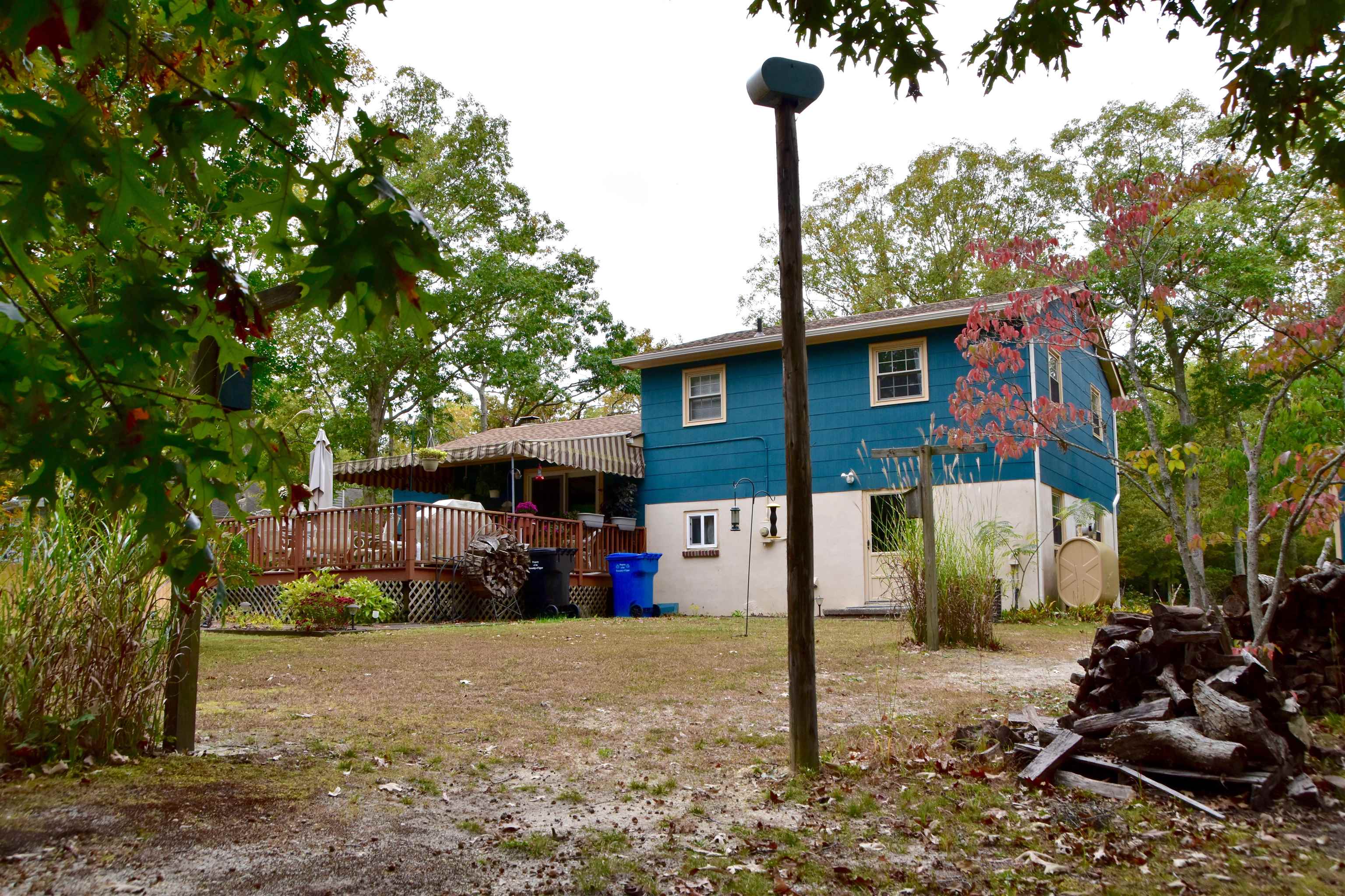 91 Tyler Road Ocean View, NJ 08230 - Photo 33 of 34 a view of a house with a backyard and tree