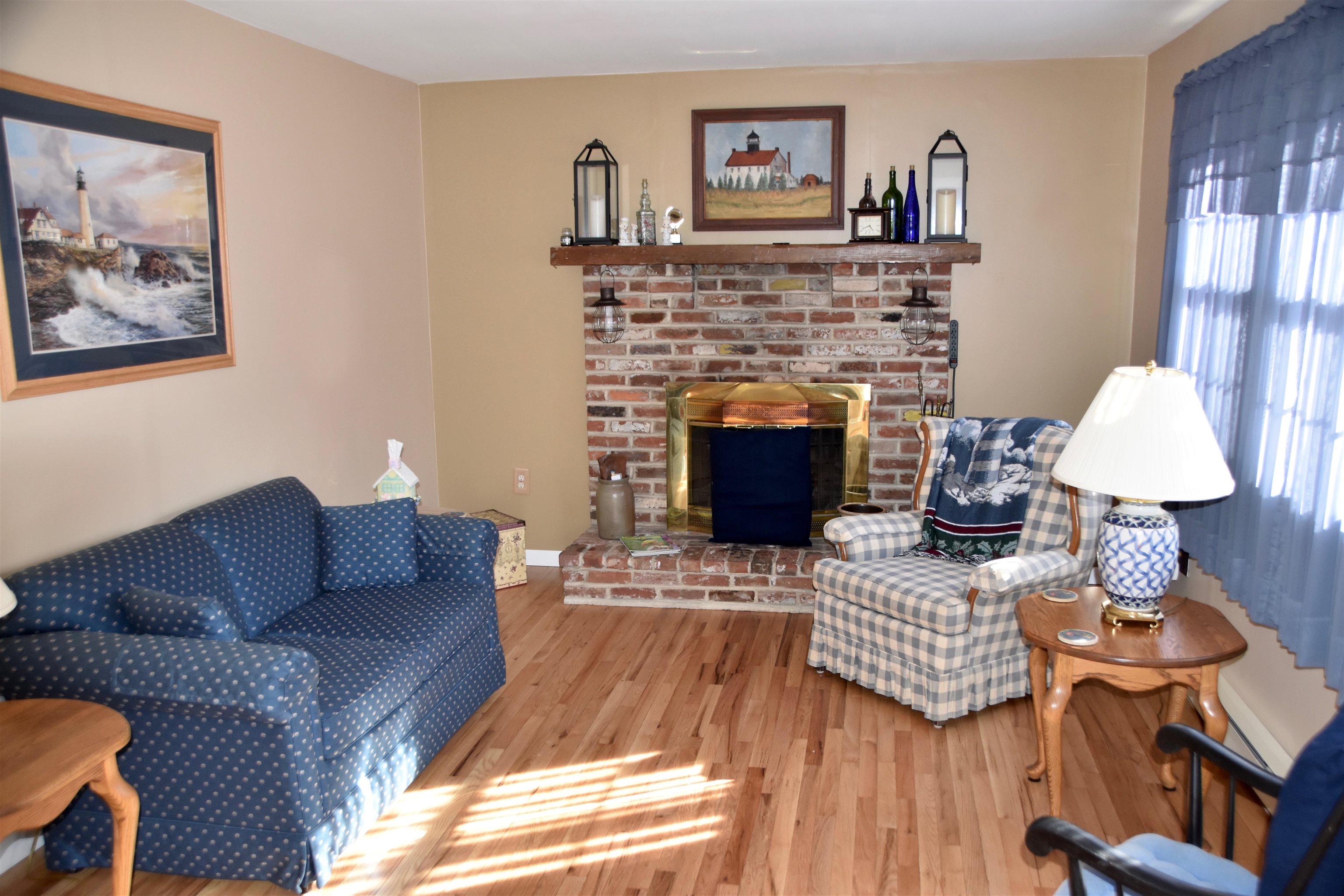 91 Tyler Road Ocean View, NJ 08230 - Photo 5 of 34 a living room with furniture a couch and a fireplace