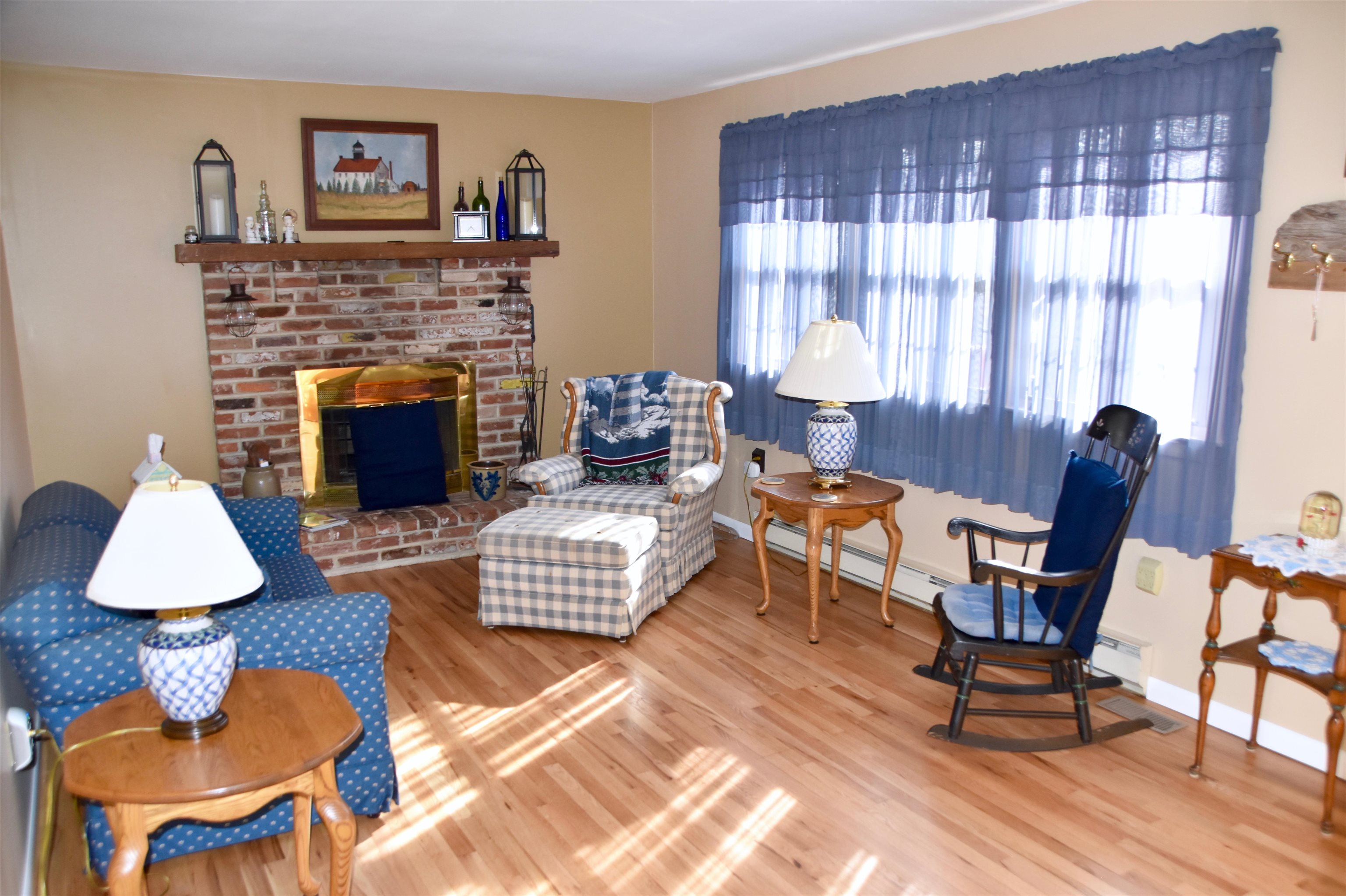 91 Tyler Road Ocean View, NJ 08230 - Photo 6 of 34 a living room with furniture and a fireplace
