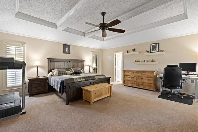 a bedroom with a bed and a chair