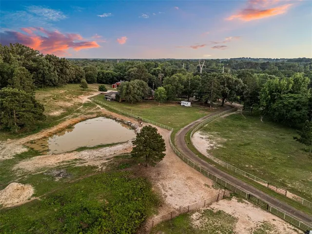 a view of a swimming pool with a yard