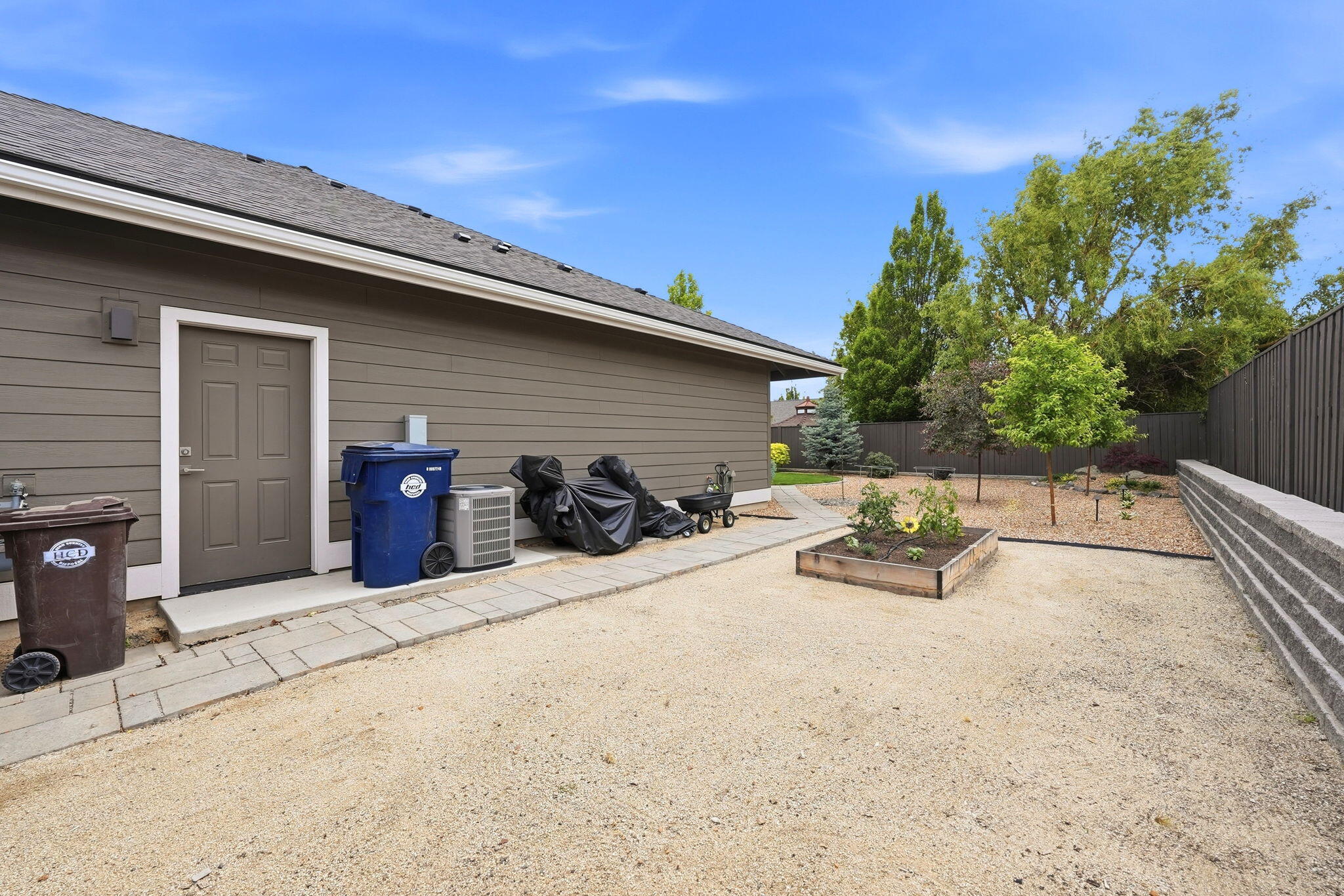 2714 Northwest 23rd Street Redmond, OR 97756 - Photo 47 of 57 a view of a patio with table and chairs and potted plants