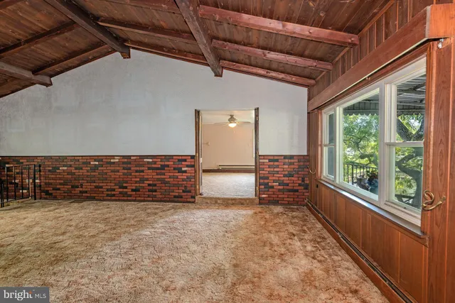 a bathroom with a granite countertop bathtub shower sink vanity and toilet