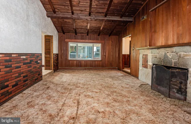 a view of a porch with chairs and backyard