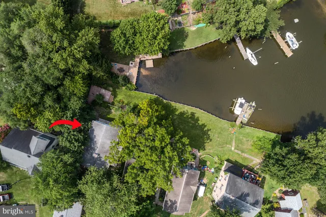 an aerial view of house with yard
