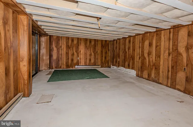 an aerial view of lake residential house with outdoor space and trees around