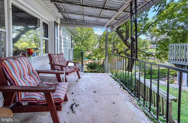 an empty room with closet and a chandelier fan