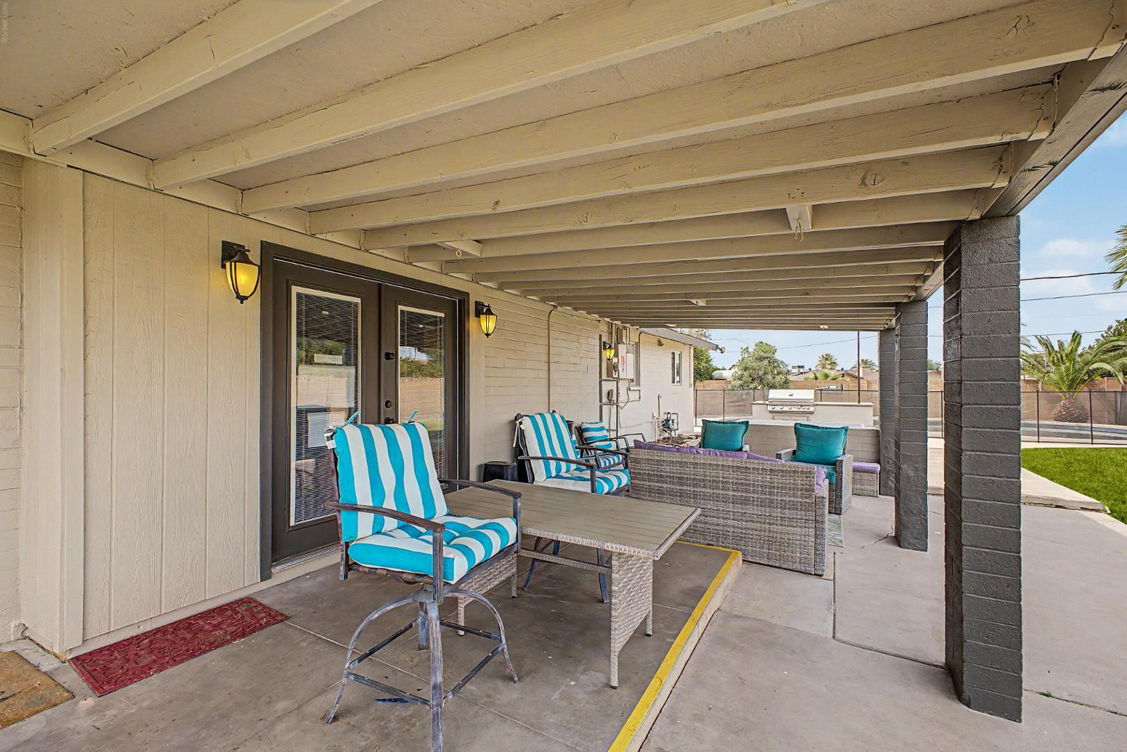 3346 East Cochise Road Phoenix, AZ 85028 - Photo 34 of 40 a building outdoor space with patio furniture and potted plants