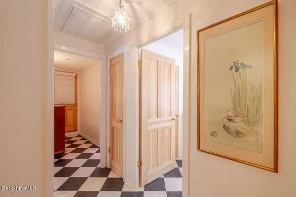 a view of a bathroom with a black and white door
