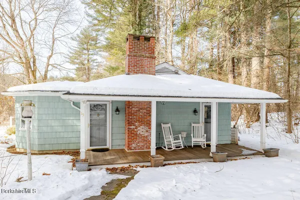 a front view of a house with a patio