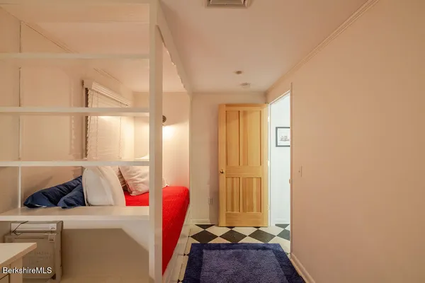 a room with a couch and a potted plant