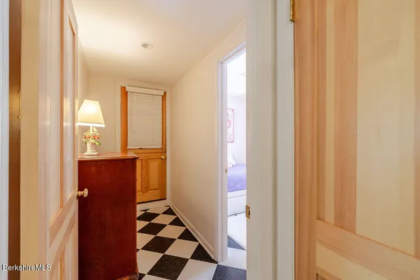 a view of a bathroom with a shower and a sink