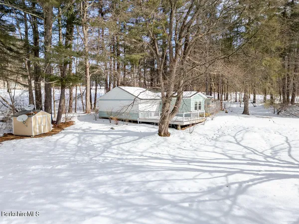 a view of a backyard of the house