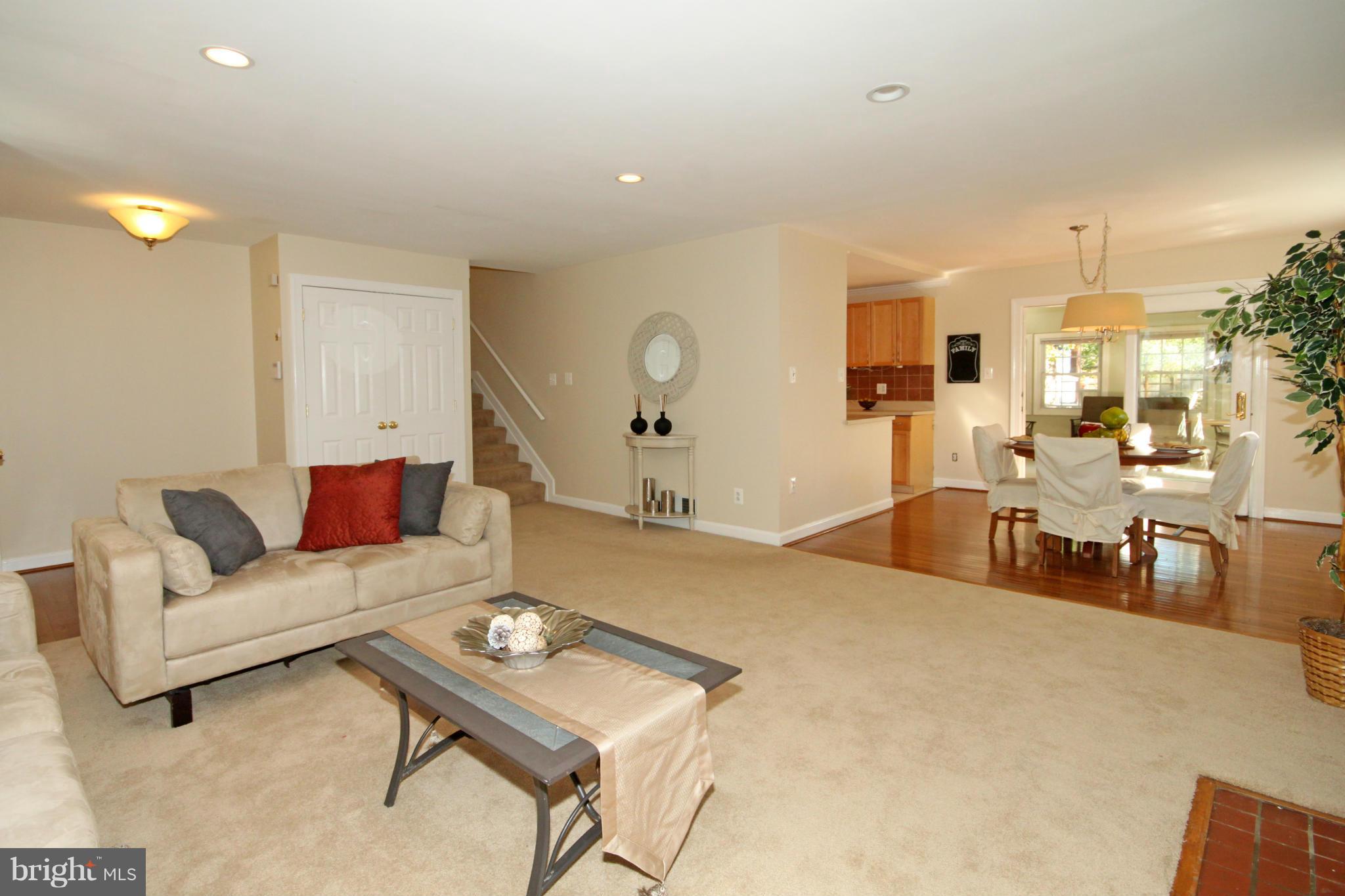 5404 Moultrie Road Springfield, VA 22151 - Photo 4 of 30 a living room with furniture and a dining table