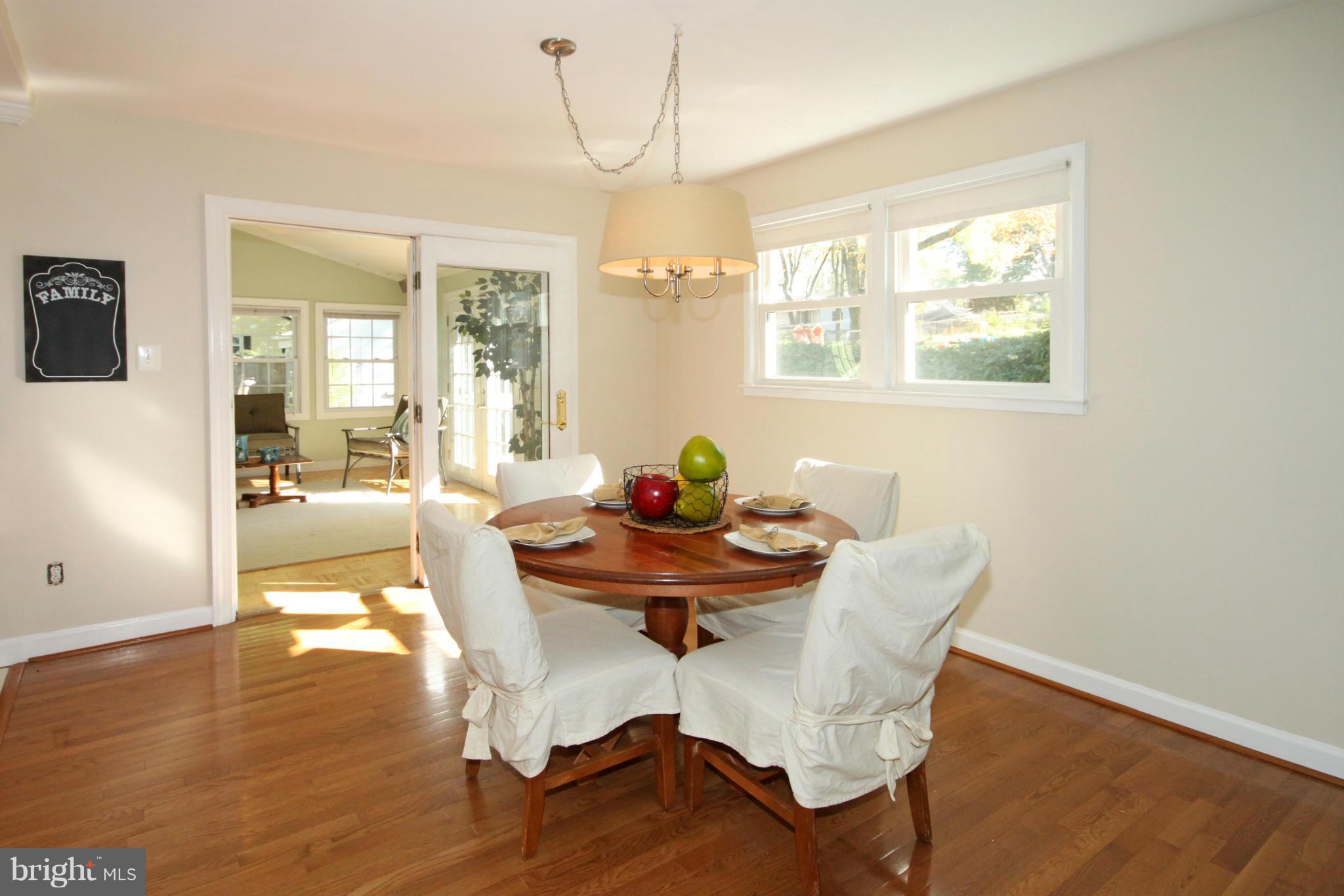 5404 Moultrie Road Springfield, VA 22151 - Photo 5 of 30 a dining room with furniture and wooden floor
