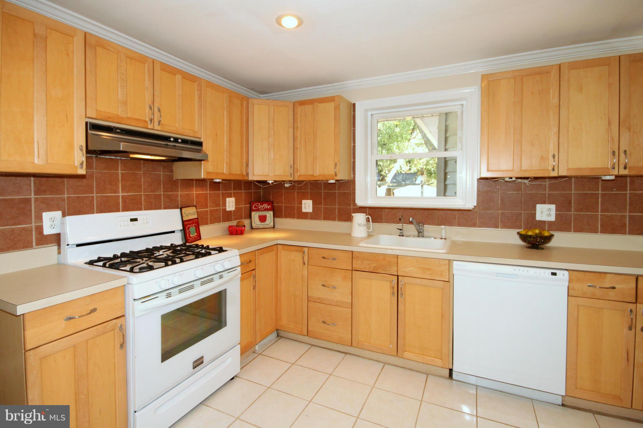 5404 Moultrie Road Springfield, VA 22151 - Photo 8 of 30 a kitchen with appliances cabinets and a sink