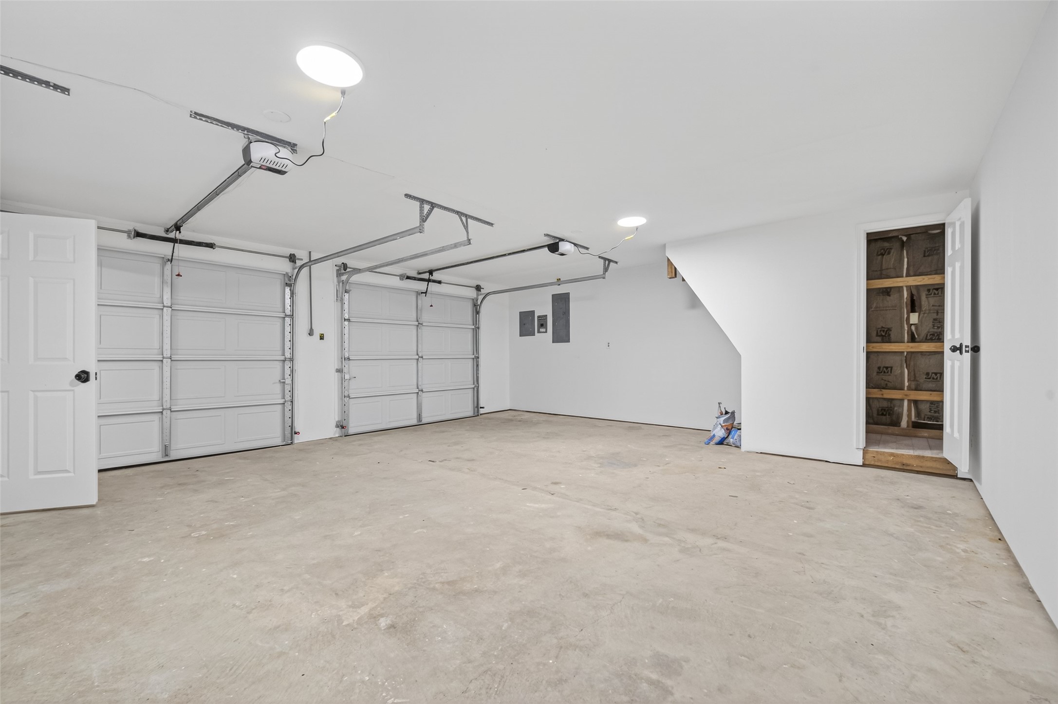 23607 Cardinal Drive Hockley, TX 77447 - Photo 41 of 50 The clean garage interior offers voluminous space for vehicle security and organized tool storage.