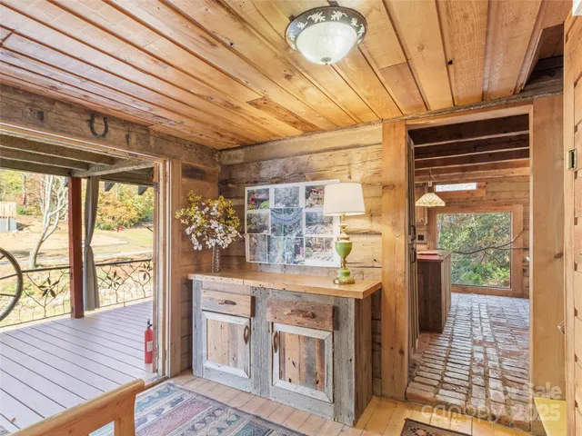 a kitchen with stainless steel appliances granite countertop a sink and wooden cabinets