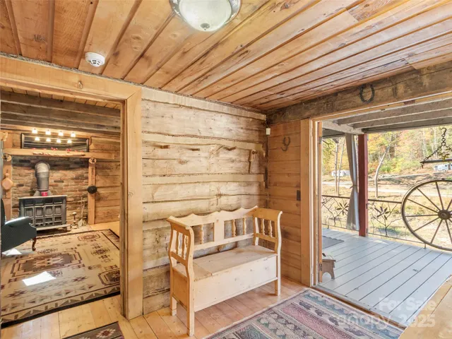 a view of a chairs and table in the balcony