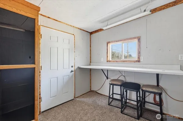 a workspace with a table and chair