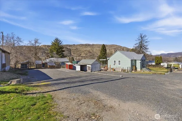 a view of a house with a street