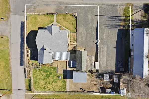 an aerial view of residential houses with outdoor space