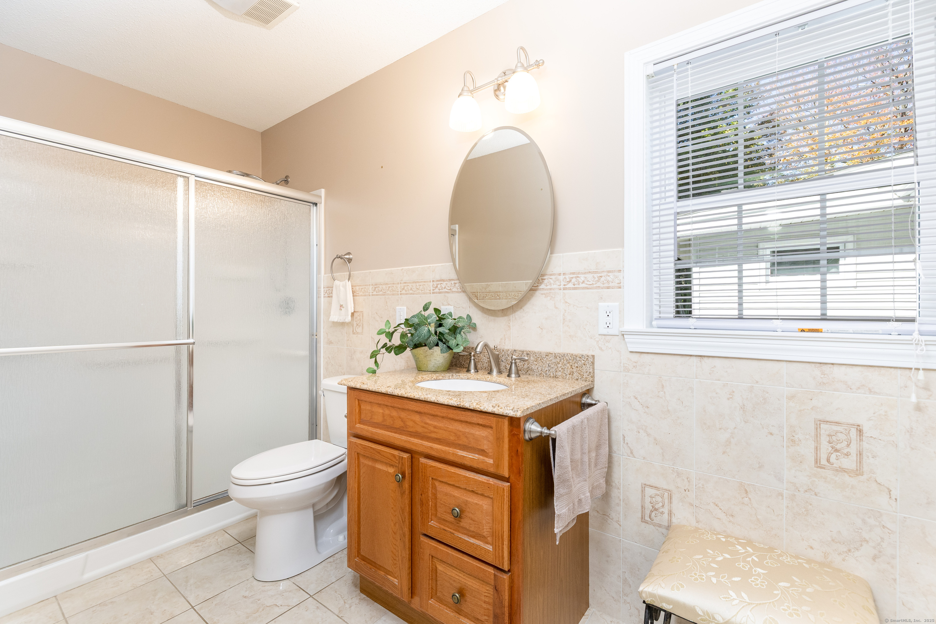 101 Collier Road Wethersfield, CT 06109 - Photo 18 of 40 a bathroom with a sink toilet and shower