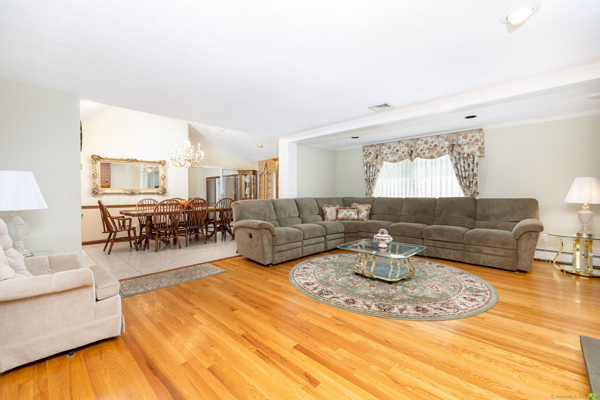 101 Collier Road Wethersfield, CT 06109 - Photo 8 of 40 a living room with furniture and a table