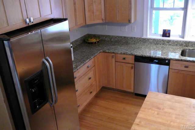 2126 Buckingham Road Raleigh, NC 27607 - Photo 5 of 11 a kitchen with granite countertop a refrigerator and a sink