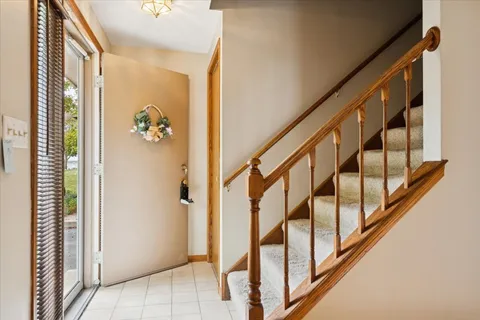 a view of an entryway with wooden floor