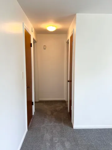 a view of hallway with closet