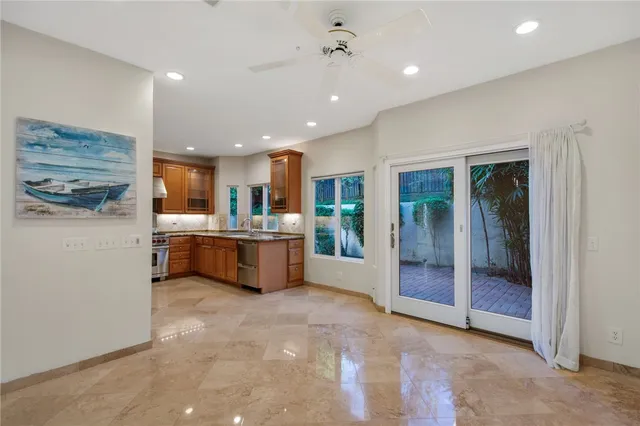 a kitchen with stainless steel appliances granite countertop a stove and a sink