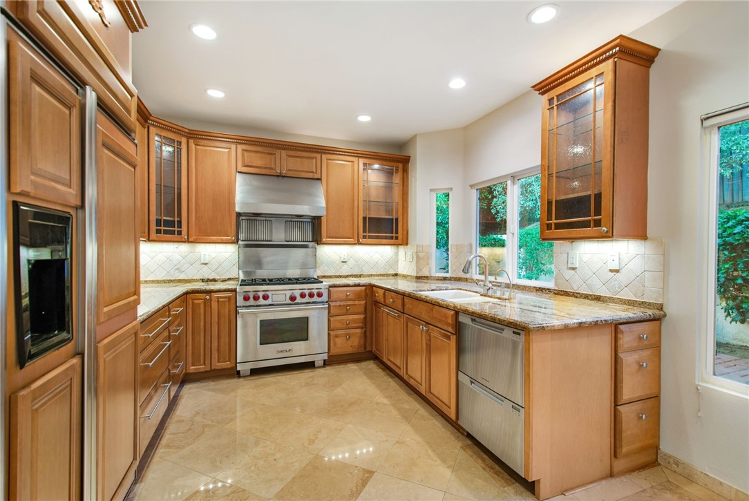 30 St Michael Dana Point, CA 92629 - Photo 12 of 33 a kitchen with stainless steel appliances granite countertop a stove and a sink