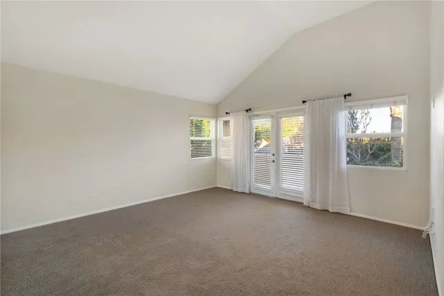 a spacious bathroom with a double vanity sink a large mirror and a bathtub